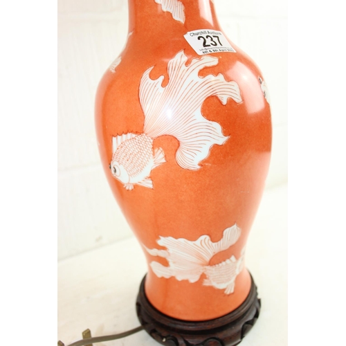237 - A pair of Chinoiserie table lamps decorated with fish, with shades