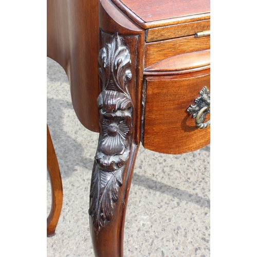 119 - An antique style Mahogany ladies writing desk with drawer, drop down front and carved details