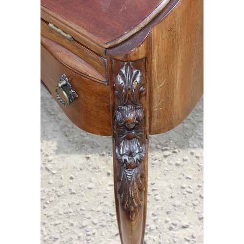 119 - An antique style Mahogany ladies writing desk with drawer, drop down front and carved details