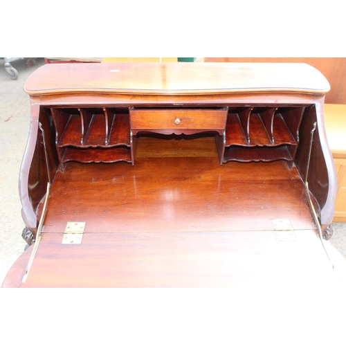 119 - An antique style Mahogany ladies writing desk with drawer, drop down front and carved details