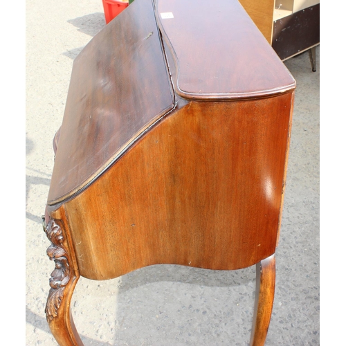 119 - An antique style Mahogany ladies writing desk with drawer, drop down front and carved details