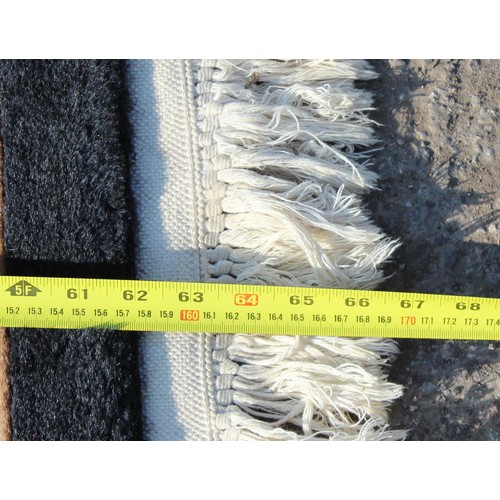 225A - An unusual black and red ground rug Chinese thick pile rug