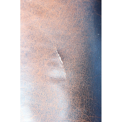 153 - A Georgian style leather brown leather Chesterfield wing back armchair