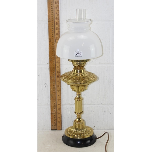 269 - A highly polished antique oil lamp with later electric conversion