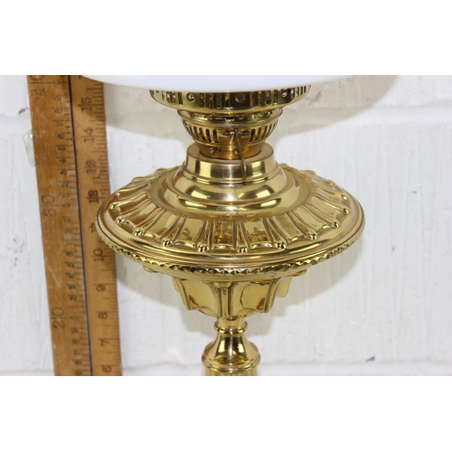 269 - A highly polished antique oil lamp with later electric conversion