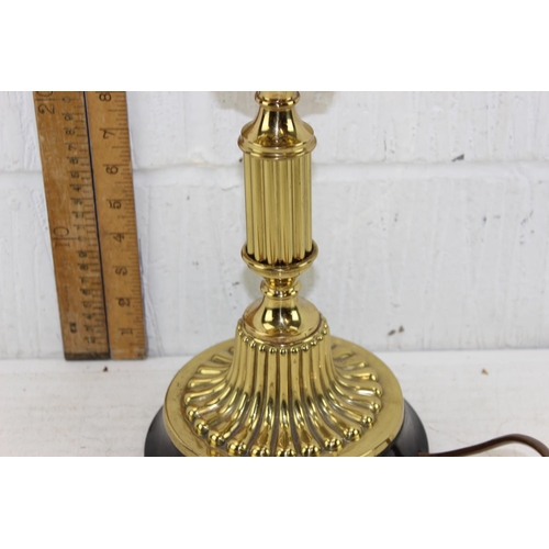 269 - A highly polished antique oil lamp with later electric conversion