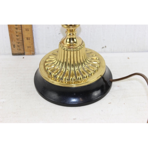 269 - A highly polished antique oil lamp with later electric conversion