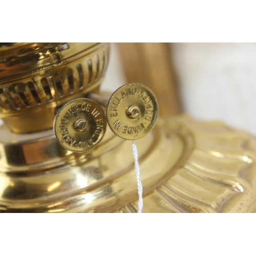 269 - A highly polished antique oil lamp with later electric conversion