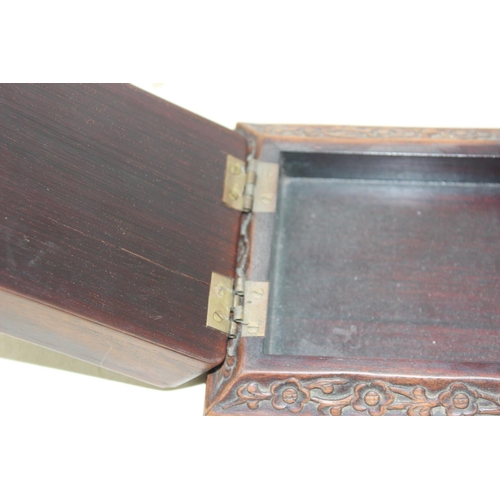 292 - An unusual Chinese carved wooden box with strap hinge, possibly a card or games box, likely early 20... 