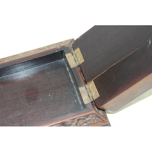 292 - An unusual Chinese carved wooden box with strap hinge, possibly a card or games box, likely early 20... 