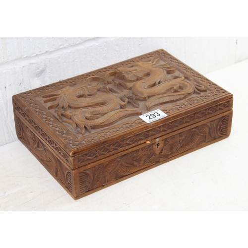 293 - An Oriental carved wooden box decorated with dragon and other mythical beasts, likely early 20th cen... 