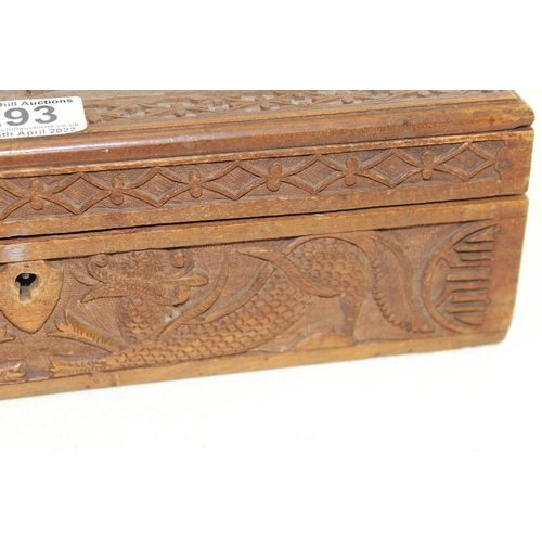293 - An Oriental carved wooden box decorated with dragon and other mythical beasts, likely early 20th cen... 