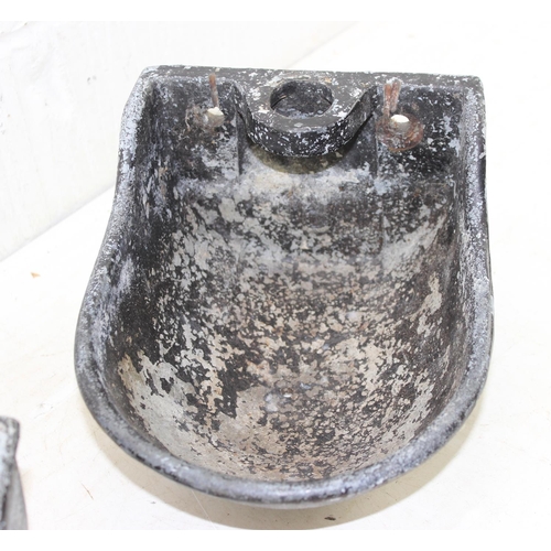 383 - A pair of vintage cast and painted metal wall mounted small water or animal feed troughs or bowls