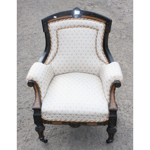 123 - Antique ebonised armchair, likely French 19th century, with Amboyna inlay