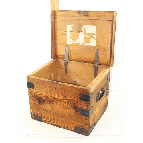 143 - An antique pitch pine box with iron banded corners