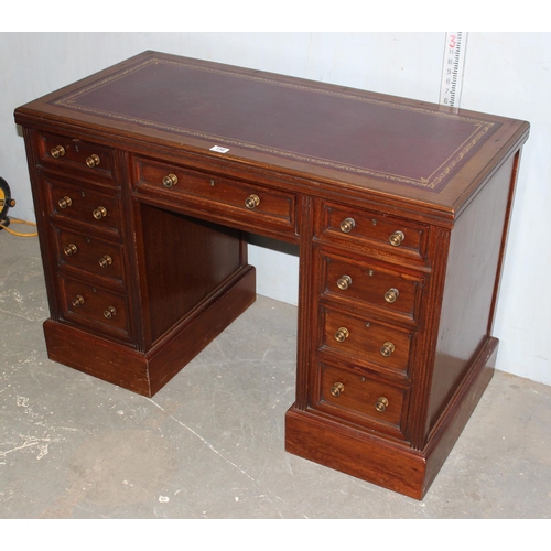156 - Red leather topped pedestal desk with brass handles