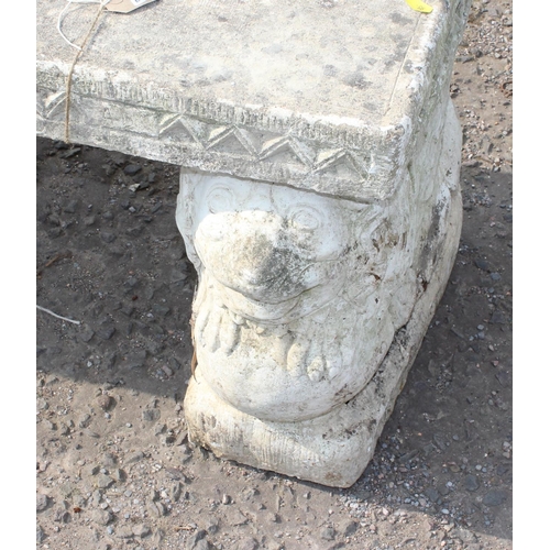 307 - Ornate concrete garden bench with dog supports