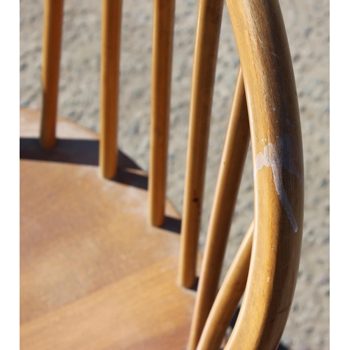 175 - A single blonde Ercol hoop back dining chair with blue & gold label