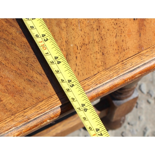 178 - An early 20th century 17th century style quarter cut oak stool or window seat on turned legs