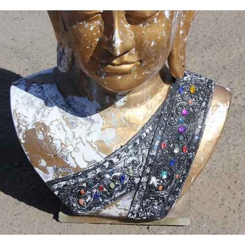 310 - A large gilt painted figure of a Buddhistic deity head