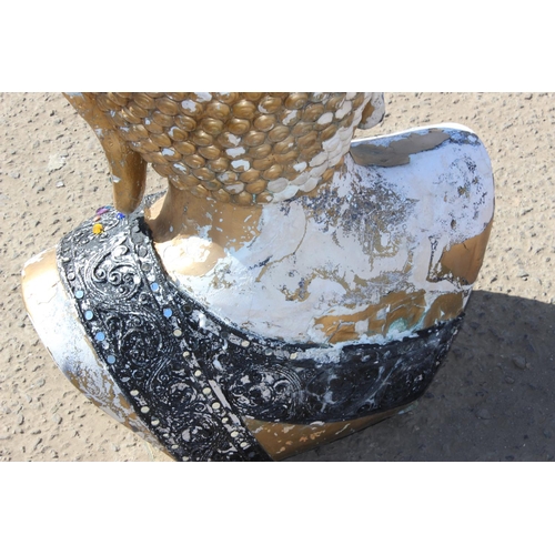 310 - A large gilt painted figure of a Buddhistic deity head