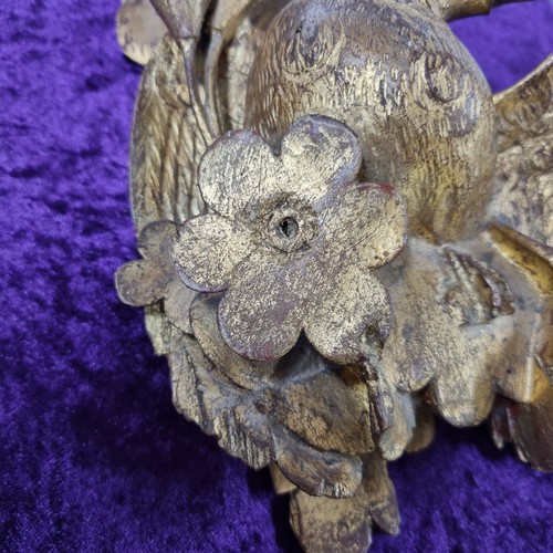 283 - Antique gilt limewood carving of a bird amongst foliage, likely 19th century