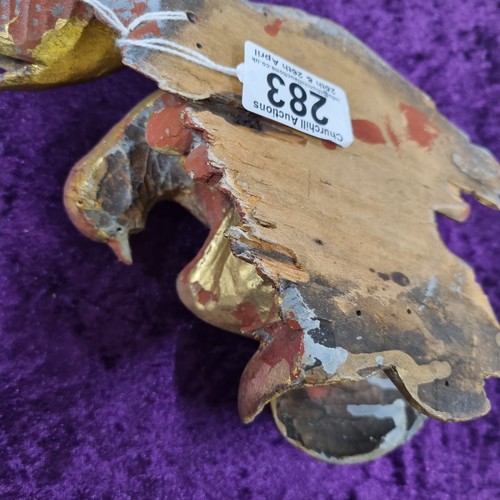 283 - Antique gilt limewood carving of a bird amongst foliage, likely 19th century