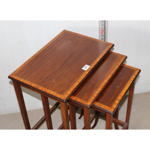 101 - Edwardian nest of tables with crossbanded inlay on splayed legs