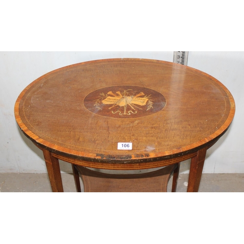 106 - An Edwardian side table with marquetry inlay depicting musical instruments and notations