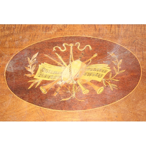 106 - An Edwardian side table with marquetry inlay depicting musical instruments and notations