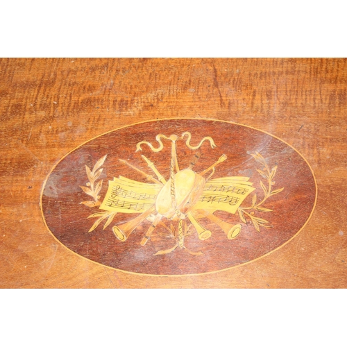 106 - An Edwardian side table with marquetry inlay depicting musical instruments and notations