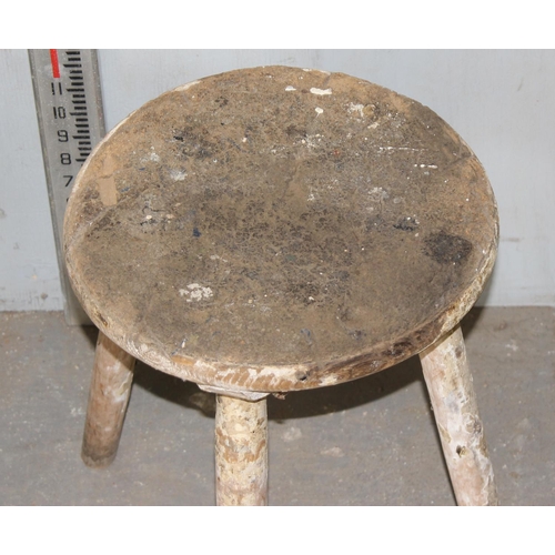 107 - 2 small rustic wooden stools