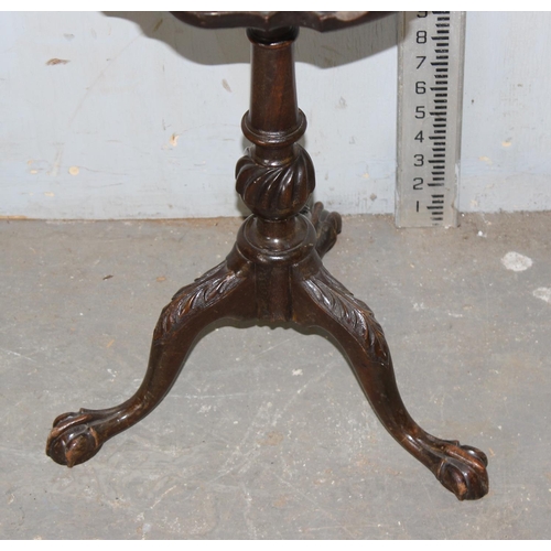 109 - A small antique mahogany wine table with impressive carving