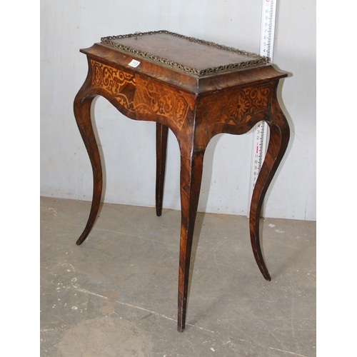 113 - A 19th century inlaid Kingwood jardiniere table, the top with pierced brass gallery and lift off cen... 