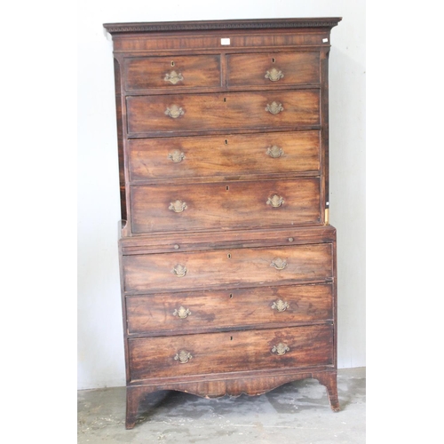 28 - A large Georgian mahogany tall boy or chest on chest, standing on bracket feet with brass fittings