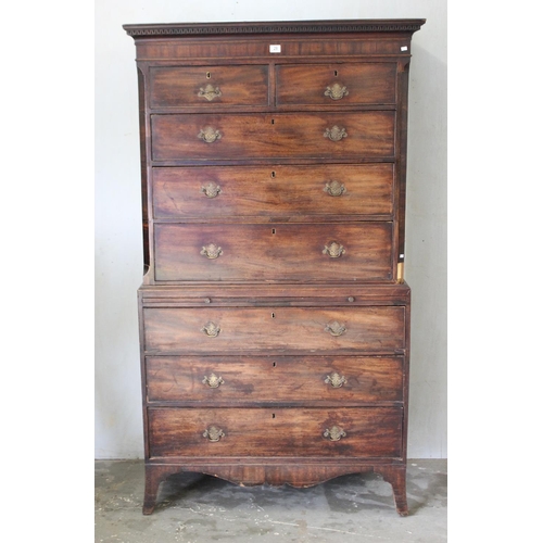 28 - A large Georgian mahogany tall boy or chest on chest, standing on bracket feet with brass fittings