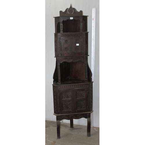 29 - An unusual 17th century style Oak corner cabinet with carved details