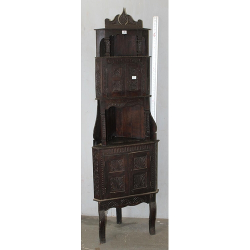 29 - An unusual 17th century style Oak corner cabinet with carved details