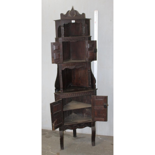 29 - An unusual 17th century style Oak corner cabinet with carved details