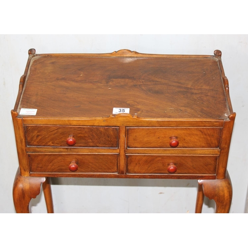 35 - An interesting 4 drawer side table or cabinet standing on cabriole legs and pad feet