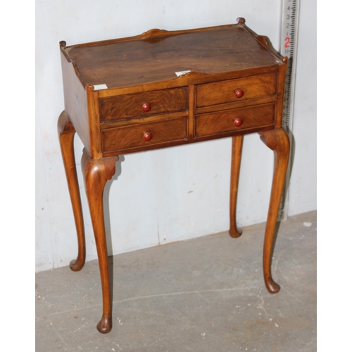 35 - An interesting 4 drawer side table or cabinet standing on cabriole legs and pad feet