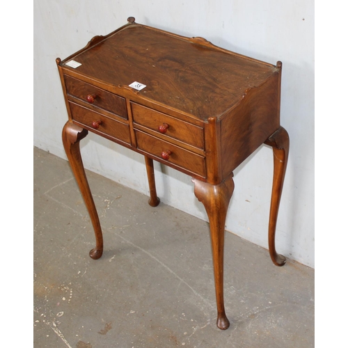 35 - An interesting 4 drawer side table or cabinet standing on cabriole legs and pad feet