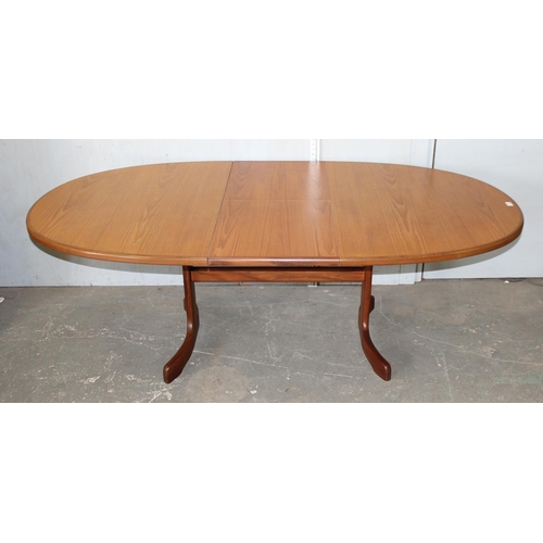 5 - A retro oval shaped G-Plan teak dining table with fold out leaf, approx 64