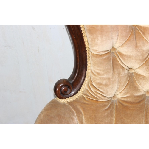 53 - Victorian mahogany framed button back chair with carved details