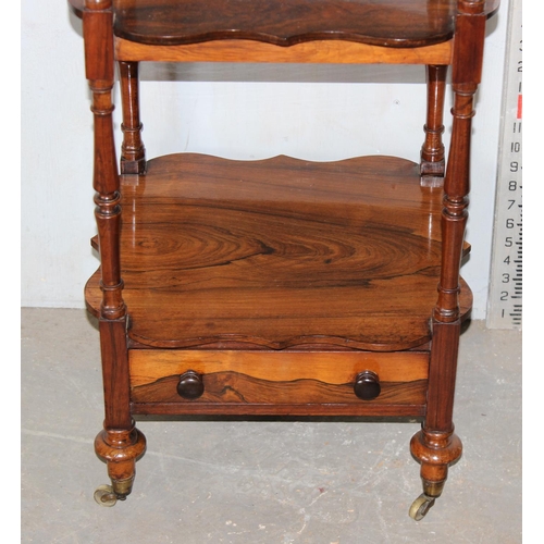 56 - A 19th century rosewood 3 tier whatnot with single drawer with ebonised bun handles and brass castor... 