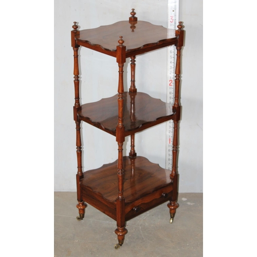 56 - A 19th century rosewood 3 tier whatnot with single drawer with ebonised bun handles and brass castor... 