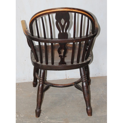 68 - An antique farmhouse Windsor armchair with Elm seat