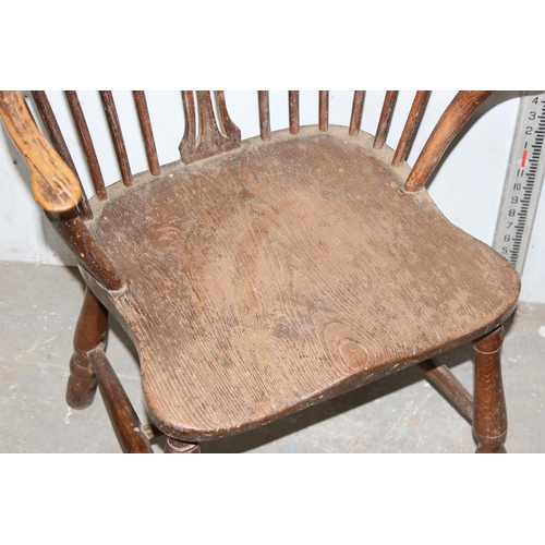 70 - An antique farmhouse Windsor armchair with Elm seat