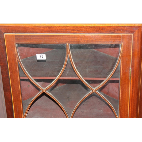 75 - An antique astral glazed Sheraton style wall cabinet with shell inlay