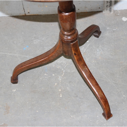 79 - A small antique mahogany tripod wine table